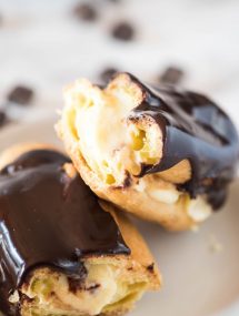 easy chocolate eclair recipe split in half on white plate