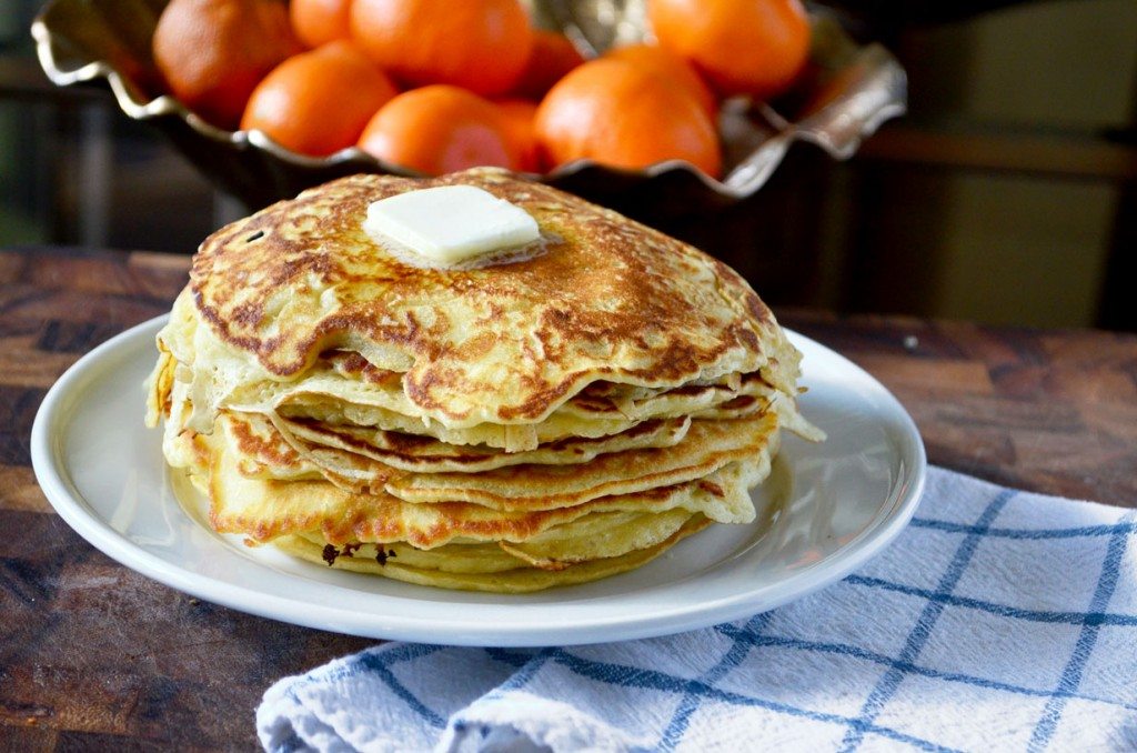 This thin pancake recipe yields soft, thin pancakes with crispy edges. Still fluffy inside, you can easily eat a whole stack of these! | @gogogogourmet