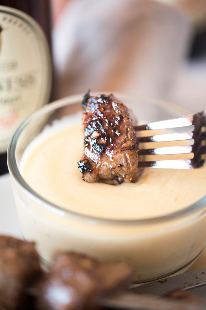 Guinness glazed beef skewer dipped in smoked gouda dipping sauce