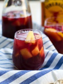 Thanksgiving recipes, fireball sangria in a glass on a white and blue towel