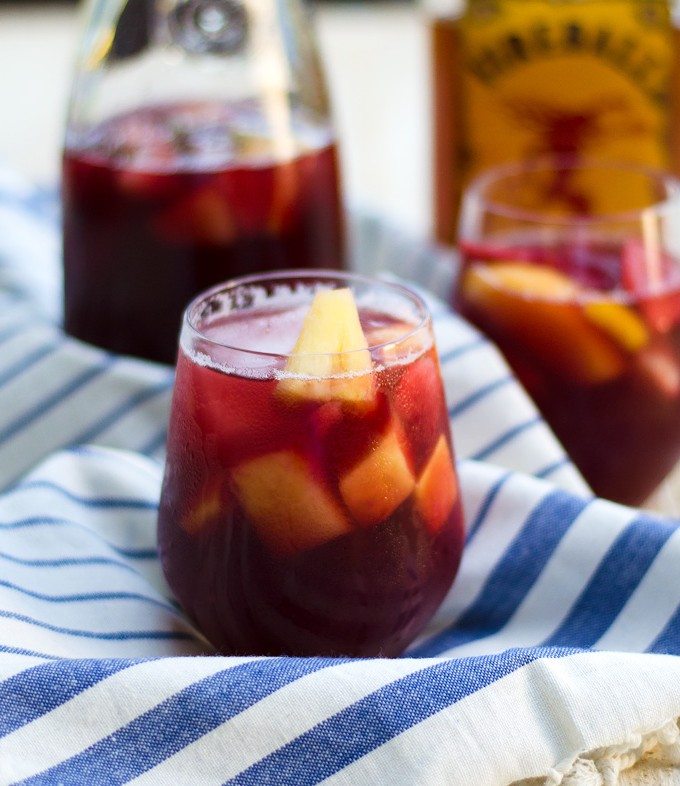 Thanksgiving recipes, fireball sangria in a glass on a white and blue towel