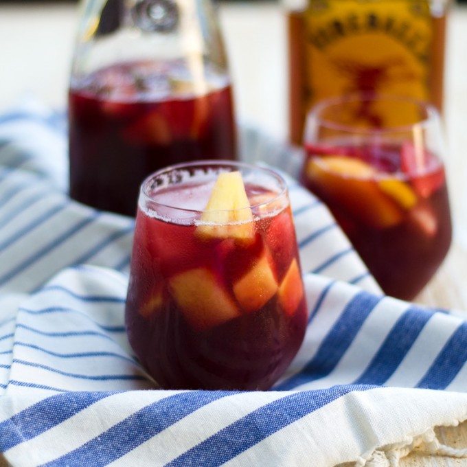 Thanksgiving recipes, fireball sangria in a glass on a white and blue towel