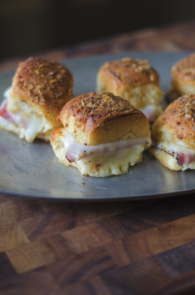 Ham and cheese sliders on a plate 