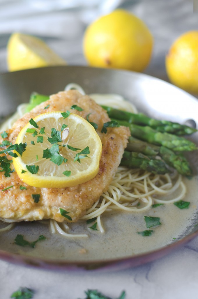 Chicken francaise served over angel hair with asparagus and lemon