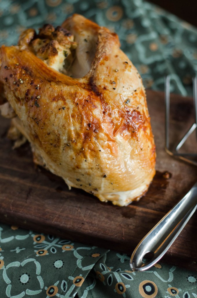 Whole oven roasted turkey breast on a cutting board