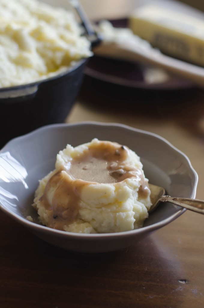 Scoop of whipped potatoes topped with gravy