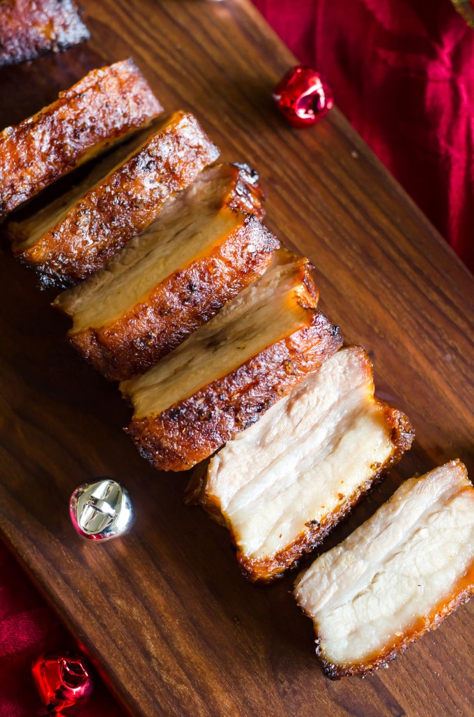 This Crispy Pork Belly recipe is marinated in Asian flavors, then roasted with a salt crust for crispy skin and tender meat. No scoring required! | @gogogogourmet