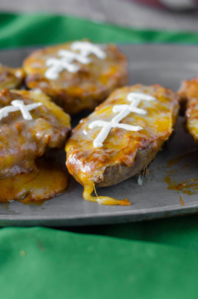 Chili Cheese Potato Skins- messy, cheesy and perfect for celebrating the big game! | Go Go Go Gourmet @gogogogourmet