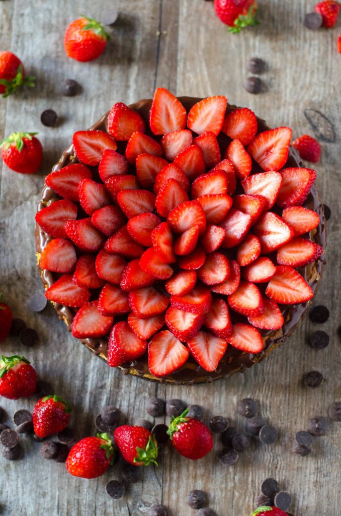 Chocolate Covered Strawberry Cheesecake - chocolate cookie crust, a layer of chocolate ganache, topped with a not-too-dense, not-too-sweet cheesecake, more ganache and fresh strawberries | Go Go Go Gourmet @gogogogourmet