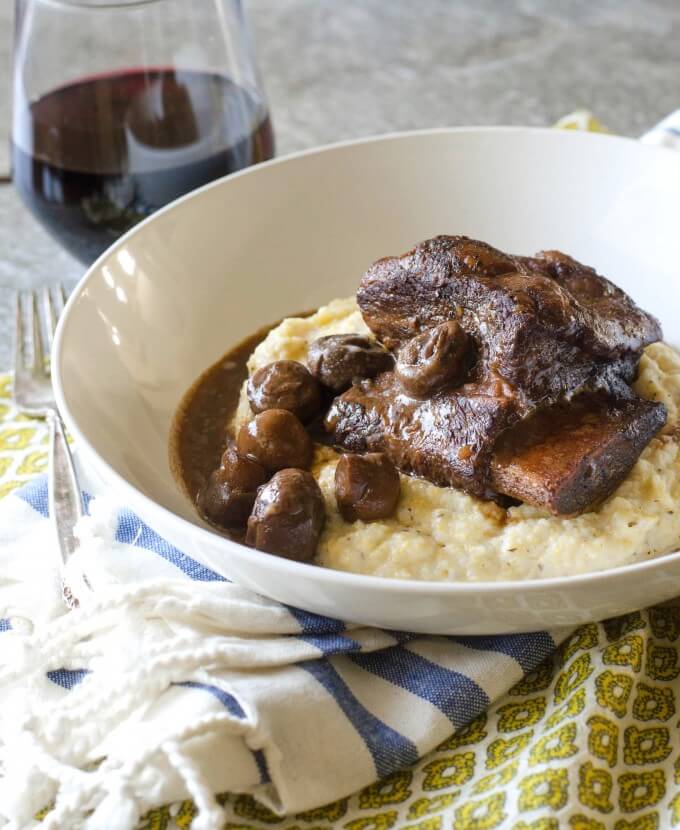 short ribs over mashed potatoes in a bowl