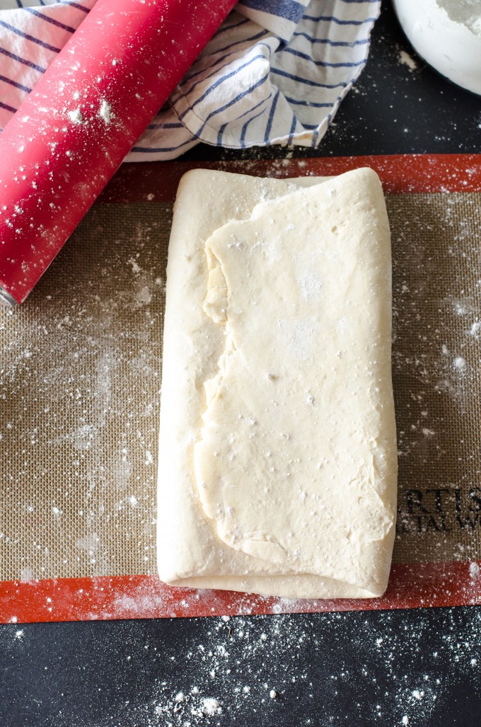Overhead view of dough on a baking mat