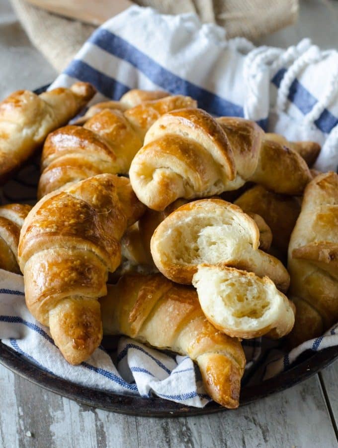Thanksgiving recipes, crescent rolls in a basket with a blue and white towel