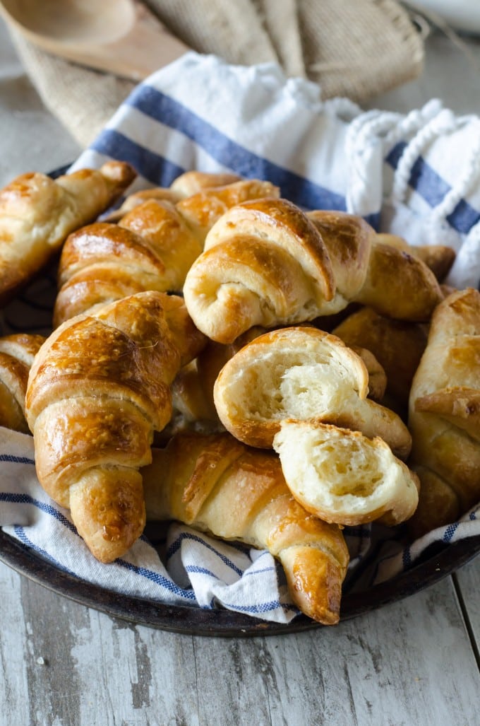 Thanksgiving recipes, crescent rolls in a basket with a blue and white towel