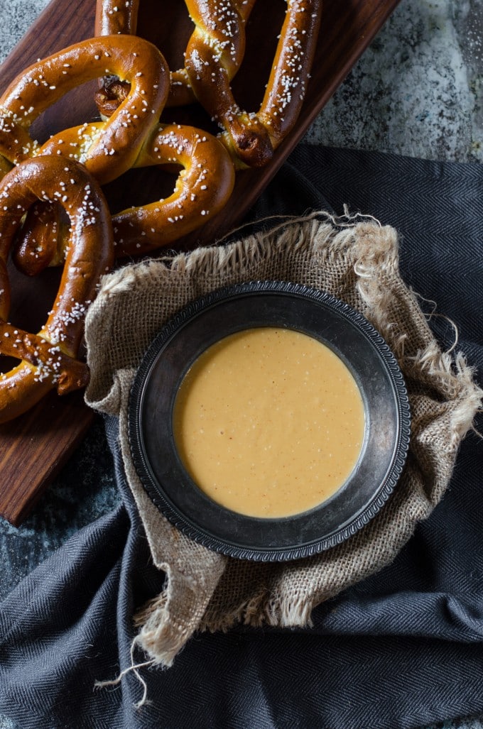 Beer cheese dip from scratch in a gray bowl on burlap