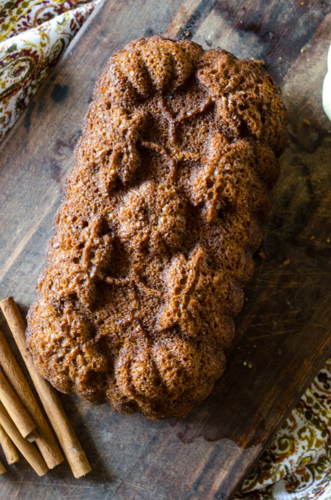 Loaf of homemade pumpkin bread recipe with cinnamon sticks