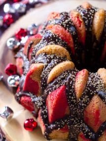 Top view of peppermint Christmas cake surrounded by jungle bells