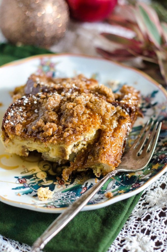 Eggnog french toast casserole cut into a slice on a plate