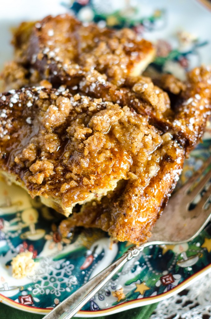 Close up of overnight eggnog french toast on a plate with a fork