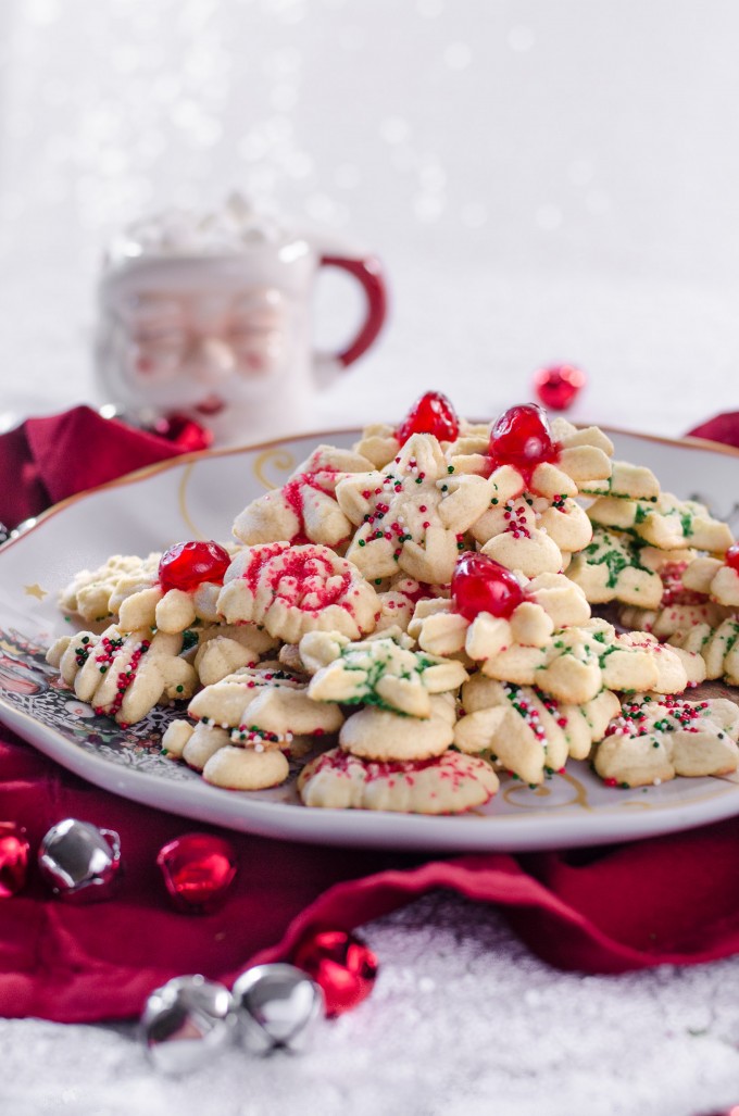 Spritz cookies on a white plate - christmas desserts