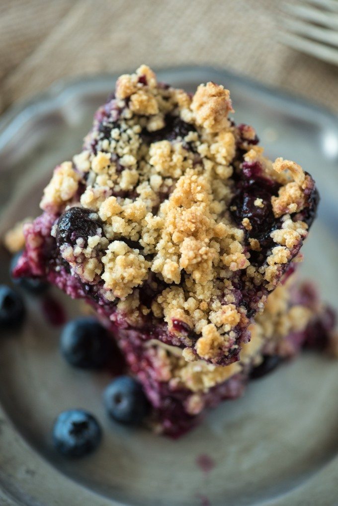Overhead view of a stack of blueberry crumb bars