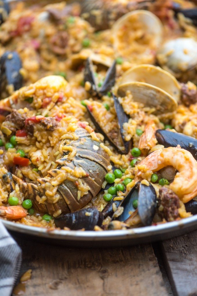 Seafood Paella- a dish packed with flavor! Chorizo, Shrimp, Lobster, Clams, Mussels, Calamari and More! | @gogogogourmet