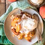 Slow Cooker Peach Cobbler Cake is the best and easiest way to use up summer's amazing peaches. No oven required! | @gogogoggourmet