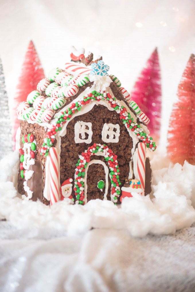 Rice krispie treat gingerbread house on fake snow - christmas desserts