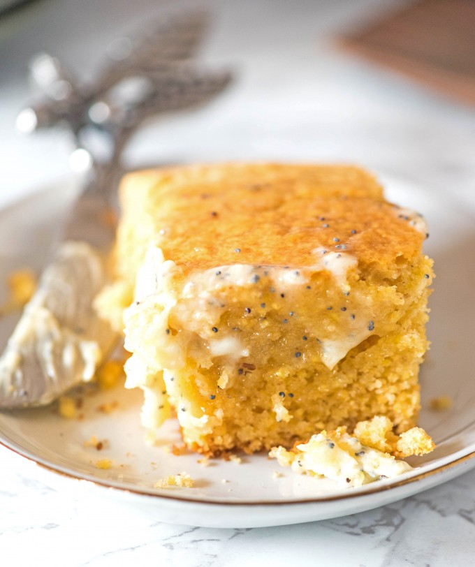 Honey cornbread on white plate with honey poppyseed butter