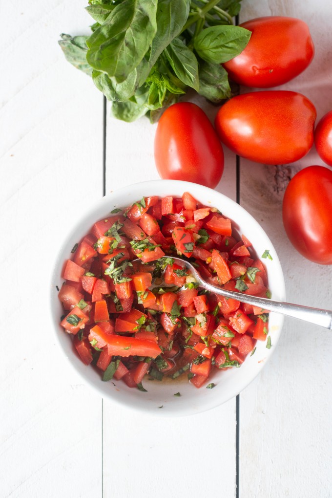 Simple bruschetta of tomato, basil, garlic, balsamic, salt and sugar