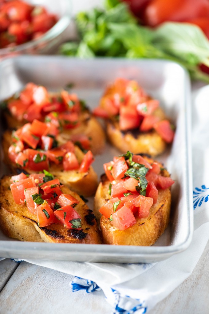 Easy tomato bruschetta with basil on baguette slices - new years eve party food