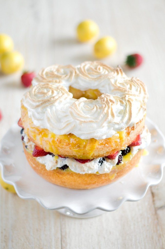 Angel food cake with berries on a cake stand