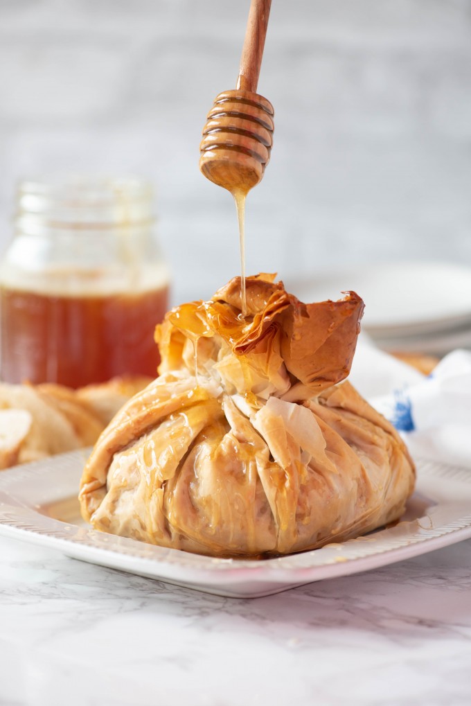 Baklava Baked Brie Appetizer drizzled with honey