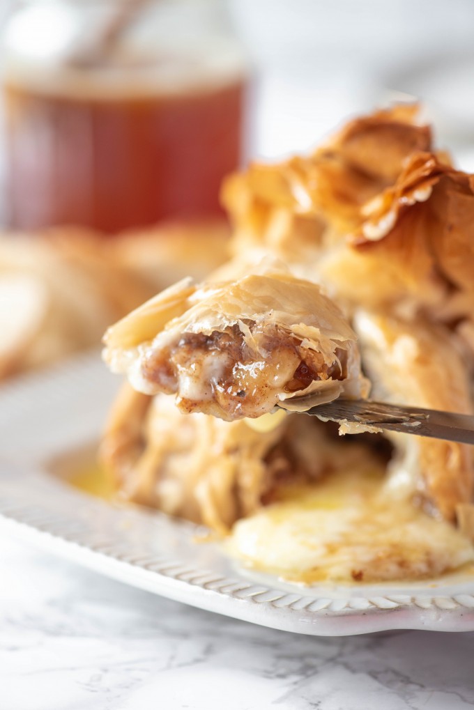 Cut baked brie with baklava filling