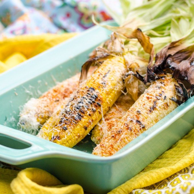 Mexican grilled corn in a blue dish