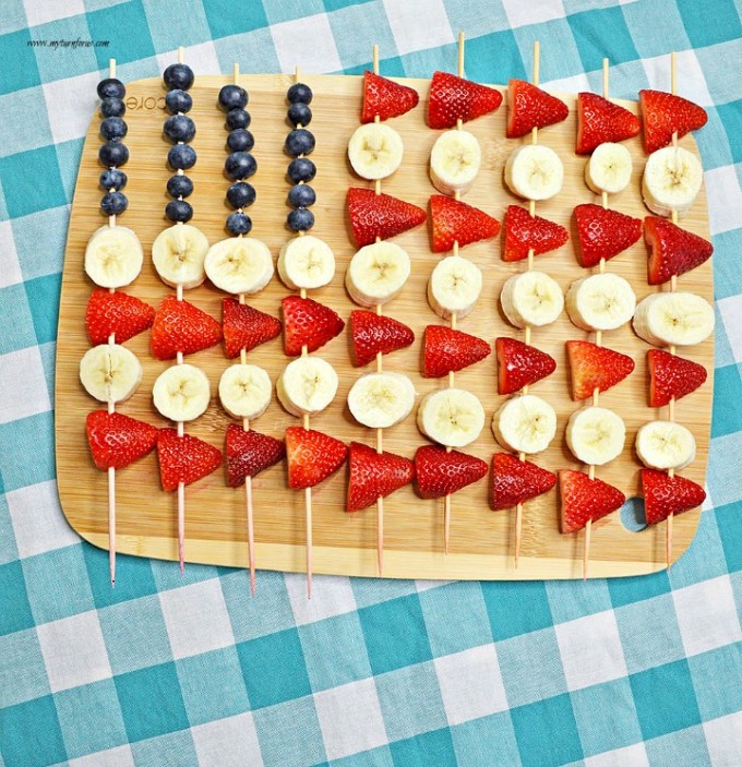 Red white and blue fruit skewers on a tray