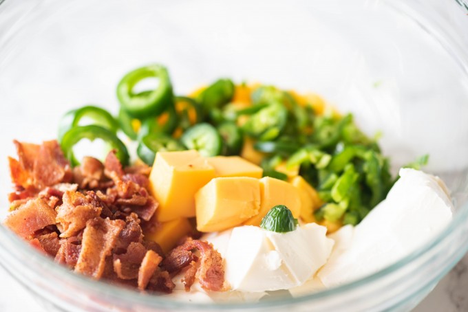 Jalapeno popper dip ingredients in a white bowl