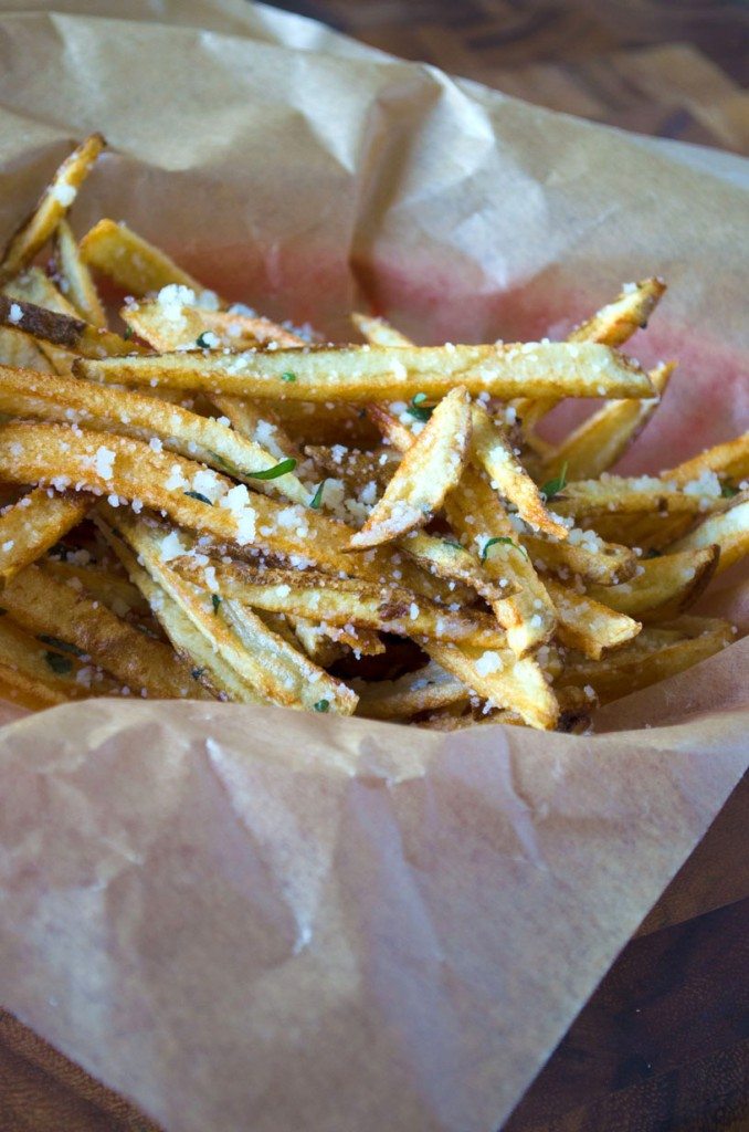 Close up of parmesan herb fries in a basket