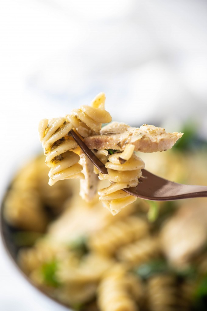 A fork full of pesto pasta salad