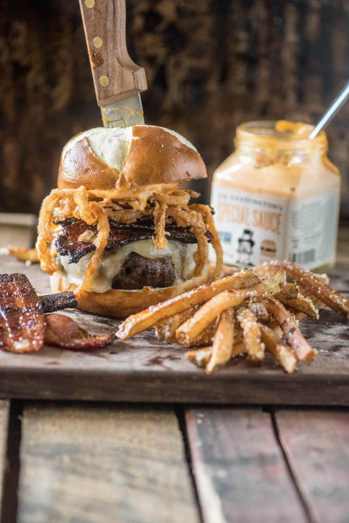 Candied bacon burger with a knife in it