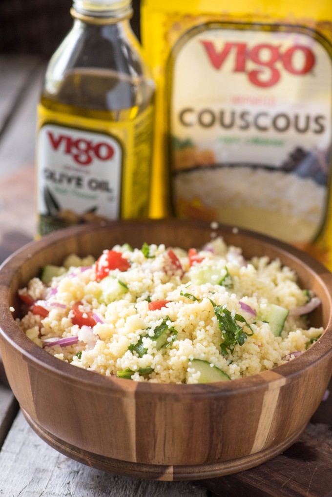Summer couscous salad in a wooden bowl