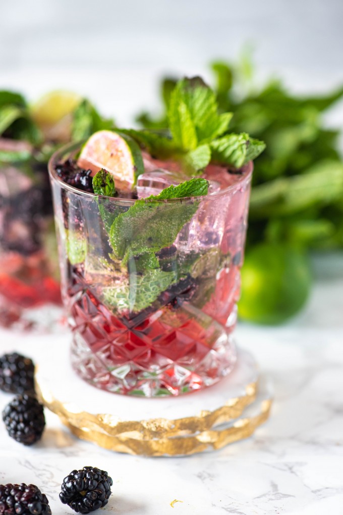 Blackberry mojito on a stack of two coasters