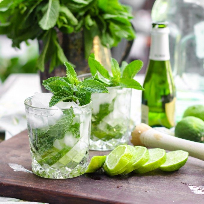 Two champagne mojitos with cut lime