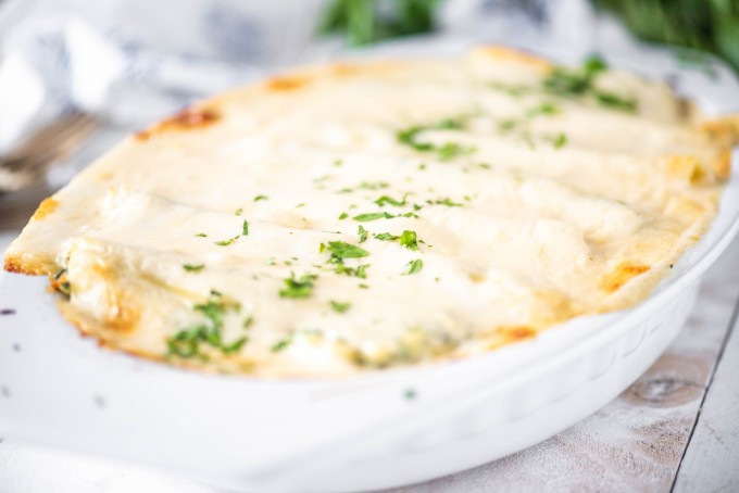 Chicken and spinach manicotti in a baking dish