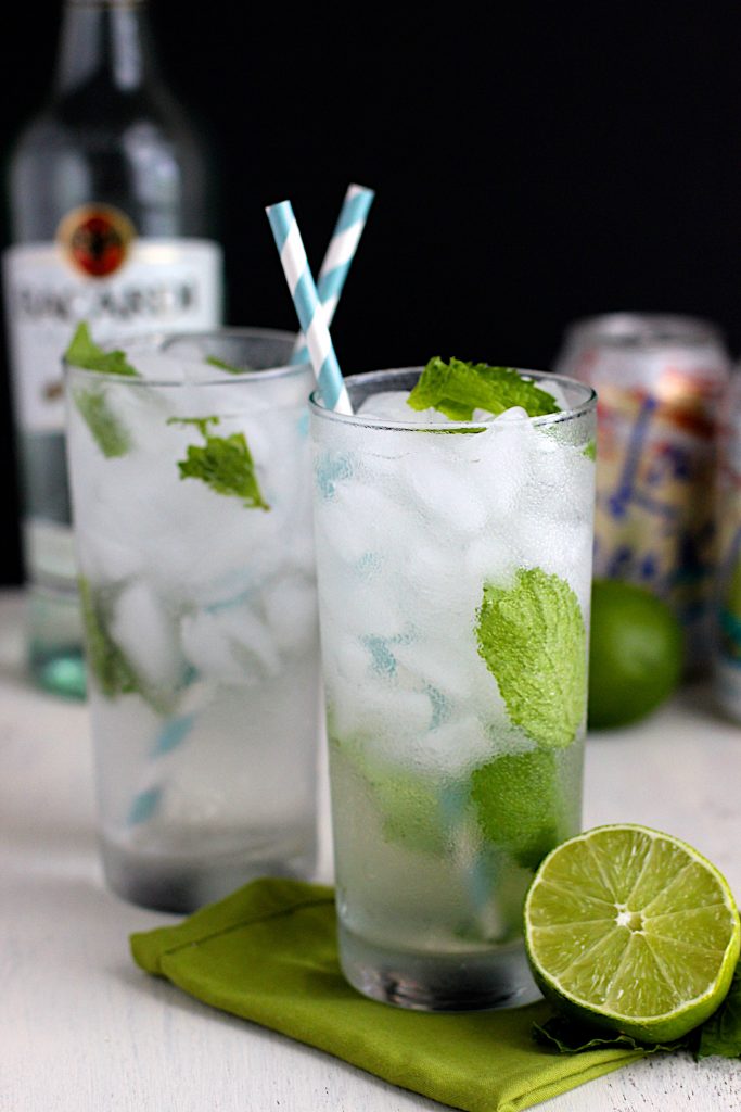 Two coconut mojitos with straws