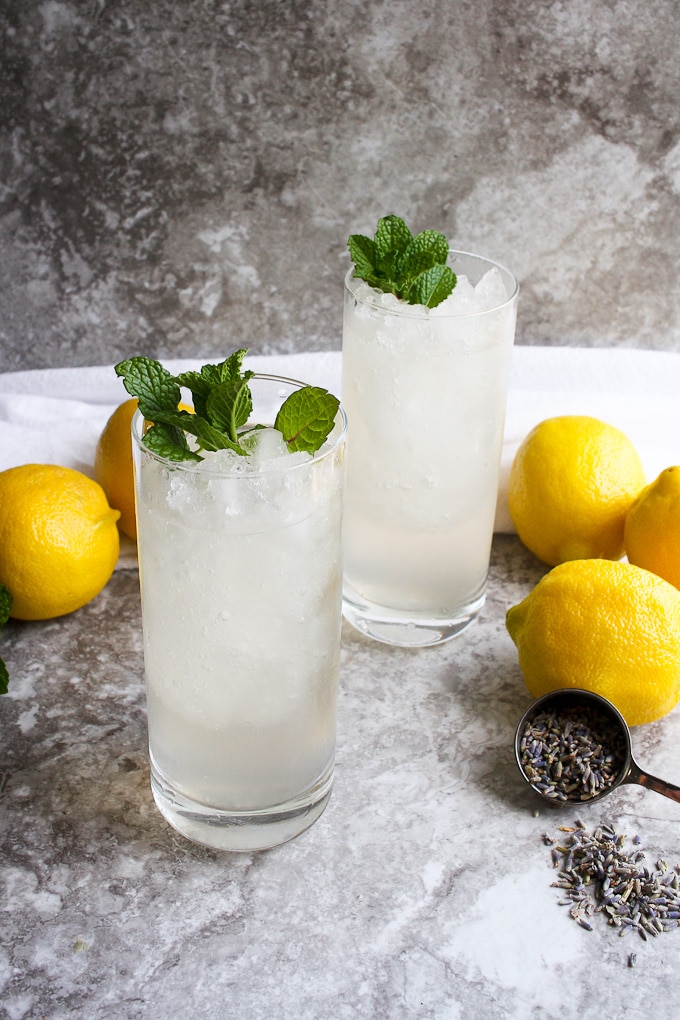 2 glasses of lavender lemonade with lemons