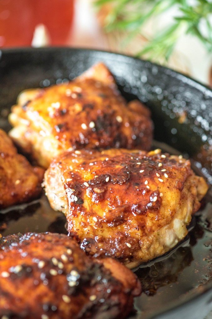 Honey garlic chicken thighs in a skillet