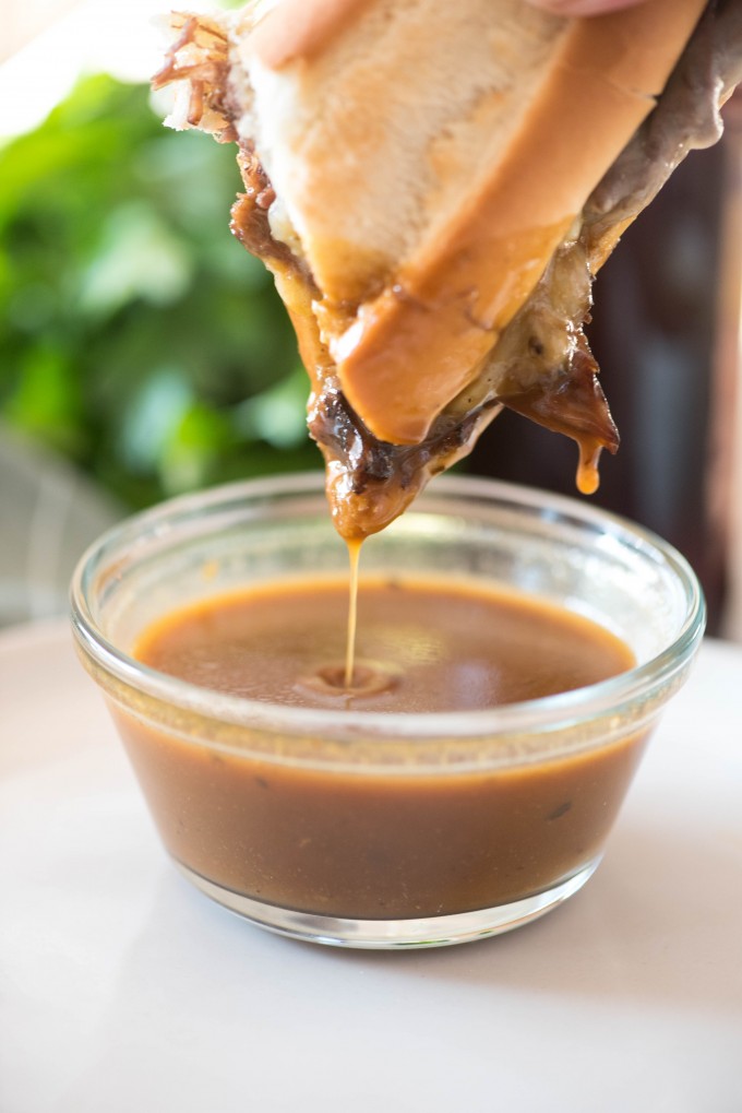 Instant pot french dip dipped into au jus