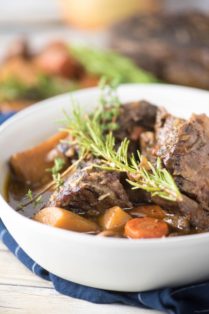 Slow cooker pot roast in a white bowl