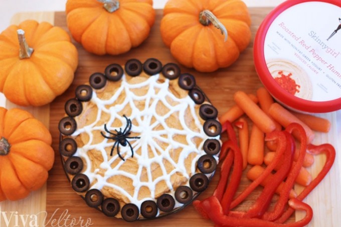 Spiderweb hummus with veggies and pumpkins