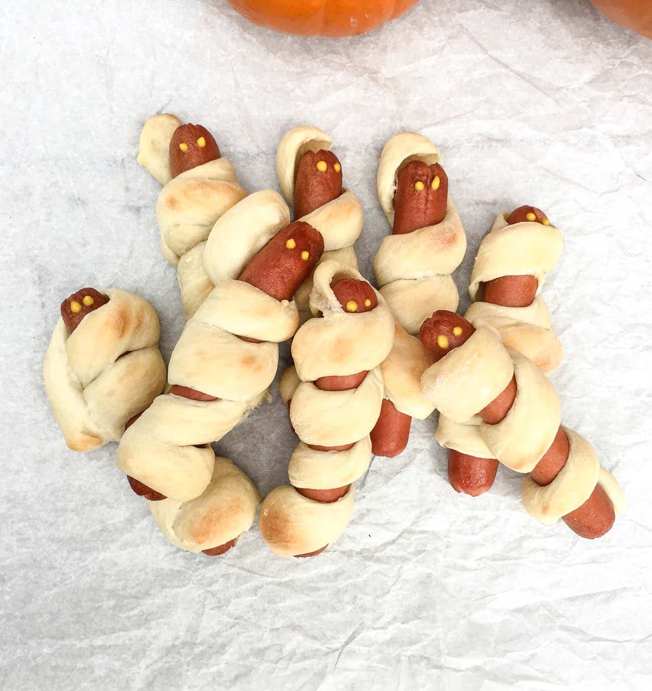 Hot dog mummies in a pile